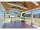 Spacious front porch with wood flooring, wooden ceiling, and white railings for easy living at 917 W Busby St, Lebanon, IN 46052