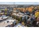 Charming neighborhood displays a blend of historic homes and modern apartments amid colorful trees at 932 N Broadway St # 4, Indianapolis, IN 46202