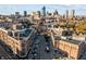 The cityscape displays a mix of historic buildings and contemporary condos, all connected by tree-lined streets at 932 N Broadway St # 4, Indianapolis, IN 46202