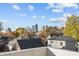 Rooftop view of the city skyline and neighborhood with autumn foliage at 932 N Broadway St # 4, Indianapolis, IN 46202