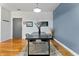 Stylish dining area with a modern table and chairs, complemented by a chic light fixture and hardwood floors at 932 N Broadway St # 4, Indianapolis, IN 46202