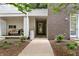 Charming front entrance with a cozy seating area and a walkway leading to the door at 932 N Broadway St # 4, Indianapolis, IN 46202