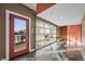 Hallway with modern glass doors leading to the outside and neutral color palette at 932 N Broadway St # 4, Indianapolis, IN 46202
