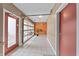Bright hallway featuring modern glass doors leading to the outside and neutral color palette at 932 N Broadway St # 4, Indianapolis, IN 46202