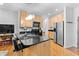 Well-equipped kitchen with stainless steel appliances, granite countertops, a breakfast bar, and ample cabinet space at 932 N Broadway St # 4, Indianapolis, IN 46202