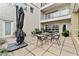 Exterior patio featuring outdoor seating with an umbrella and decorative plants at 932 N Broadway St # 4, Indianapolis, IN 46202