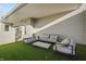 Rooftop patio with artificial grass, outdoor seating, and modern decor at 932 N Broadway St # 4, Indianapolis, IN 46202
