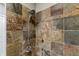 Tiled shower with decorative accents and sleek fixtures, designed for a spa-like experience and modern convenience at 932 N Broadway St # 4, Indianapolis, IN 46202