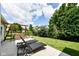 Relaxing backyard with outdoor seating, a wooden swing, and a well-maintained lawn, perfect for leisure at 10306 Tybalt Dr, Fishers, IN 46038