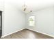 Light-filled bedroom with wood-look floors and a pendant light fixture at 10306 Tybalt Dr, Fishers, IN 46038