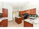 Well-lit kitchen with stainless steel appliances, granite countertops, and custom cabinetry at 10306 Tybalt Dr, Fishers, IN 46038