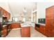 Spacious kitchen featuring modern lighting, stainless appliances, and granite countertops at 10306 Tybalt Dr, Fishers, IN 46038