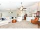Open concept living room with a large sectional sofa and views of the kitchen at 10306 Tybalt Dr, Fishers, IN 46038