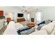 Cozy living room featuring plush seating, a fireplace, and a TV at 10306 Tybalt Dr, Fishers, IN 46038