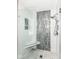 Contemporary shower with a glass enclosure, a built-in seat, and stylish tilework at 10306 Tybalt Dr, Fishers, IN 46038
