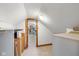 Image shows attic storage space through doorway in the home at 10455 Trewithen Ln, Carmel, IN 46032