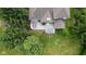 Aerial view of a well-appointed backyard deck with outdoor furniture and dining area at 10455 Trewithen Ln, Carmel, IN 46032
