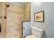 Bathroom with walk-in tile shower and a frameless glass door at 10455 Trewithen Ln, Carmel, IN 46032