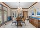 Dining room showcasing elegant decor, wainscotting, and natural light at 10455 Trewithen Ln, Carmel, IN 46032