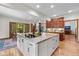 Well-designed kitchen offers an island with cooktop and ample cabinet space at 10455 Trewithen Ln, Carmel, IN 46032