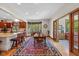 Bright kitchen features a large window, dining area, and access to the outdoors at 10455 Trewithen Ln, Carmel, IN 46032