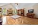 Inviting living room features vaulted ceilings, a brick fireplace, and hardwood floors at 10455 Trewithen Ln, Carmel, IN 46032