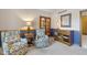 Comfortable living room with stylish chairs, wooden accents, and soft lighting at 10455 Trewithen Ln, Carmel, IN 46032