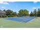 Outdoor tennis court offers recreation and a private amenity in an active community at 10455 Trewithen Ln, Carmel, IN 46032