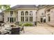 Backyard patio with dining sets, manicured garden beds and the architectural details of the house at 1089 Laurelwood, Carmel, IN 46032