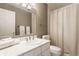 Bright bathroom with a marble countertop and a shower with neutral colored shower curtain at 1089 Laurelwood, Carmel, IN 46032