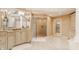 Elegant bathroom features glass door shower, chandelier lighting, and vanity at 1089 Laurelwood, Carmel, IN 46032