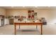 Spacious craft room with a large table, built-in shelving, and plenty of storage space at 1089 Laurelwood, Carmel, IN 46032