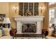 Sophisticated living room with a classic fireplace, ornate details, and stylish decor at 1089 Laurelwood, Carmel, IN 46032