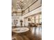 Grand foyer with a high ceiling, chandelier, hardwood floors, and an open floor plan at 1089 Laurelwood, Carmel, IN 46032