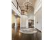 Spacious foyer with a soaring ceiling, chandelier, and elegant double doors at 1089 Laurelwood, Carmel, IN 46032