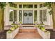 Charming front entrance with beautiful landscaping, brick steps, and elegant double doors at 1089 Laurelwood, Carmel, IN 46032