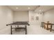 Brightly lit game room with a ping pong table and additional seating at 1089 Laurelwood, Carmel, IN 46032