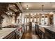 Custom kitchen featuring a large island, granite counters, and stainless steel appliances at 1089 Laurelwood, Carmel, IN 46032