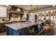 Elegant kitchen with a large island, granite counters, stainless appliances, and custom cabinetry at 1089 Laurelwood, Carmel, IN 46032