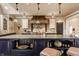Well-appointed kitchen with granite countertops, a custom hood, and professional appliances at 1089 Laurelwood, Carmel, IN 46032