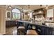 Beautiful kitchen featuring granite countertops, a custom range hood, and ample storage at 1089 Laurelwood, Carmel, IN 46032