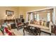 Cozy living room with comfortable seating, a patterned rug, and beautiful natural light at 1089 Laurelwood, Carmel, IN 46032