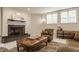 Cozy living room with a fireplace and comfortable seating area, perfect for relaxing at 1089 Laurelwood, Carmel, IN 46032