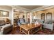 Open-concept living room showcasing comfortable seating, wood floors, and seamless flow to other areas at 1089 Laurelwood, Carmel, IN 46032