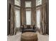 Bright sitting room features large windows with curtains, and seating area at 1089 Laurelwood, Carmel, IN 46032