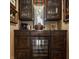Custom wet bar area with a built-in wine fridge, and sleek wood cabinetry at 1089 Laurelwood, Carmel, IN 46032
