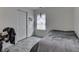 Neutral bedroom with natural light from the window and a spacious closet offers cozy comfort at 11117 Waterfield Pl, Indianapolis, IN 46235