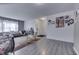 Bright living room with wood floors, neutral walls, and an open layout at 11117 Waterfield Pl, Indianapolis, IN 46235