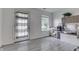 Cozy room with a large window, ample natural light, and a back door at 11117 Waterfield Pl, Indianapolis, IN 46235