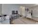 Spacious living room with wood floors, neutral walls, and a fireplace at 11117 Waterfield Pl, Indianapolis, IN 46235